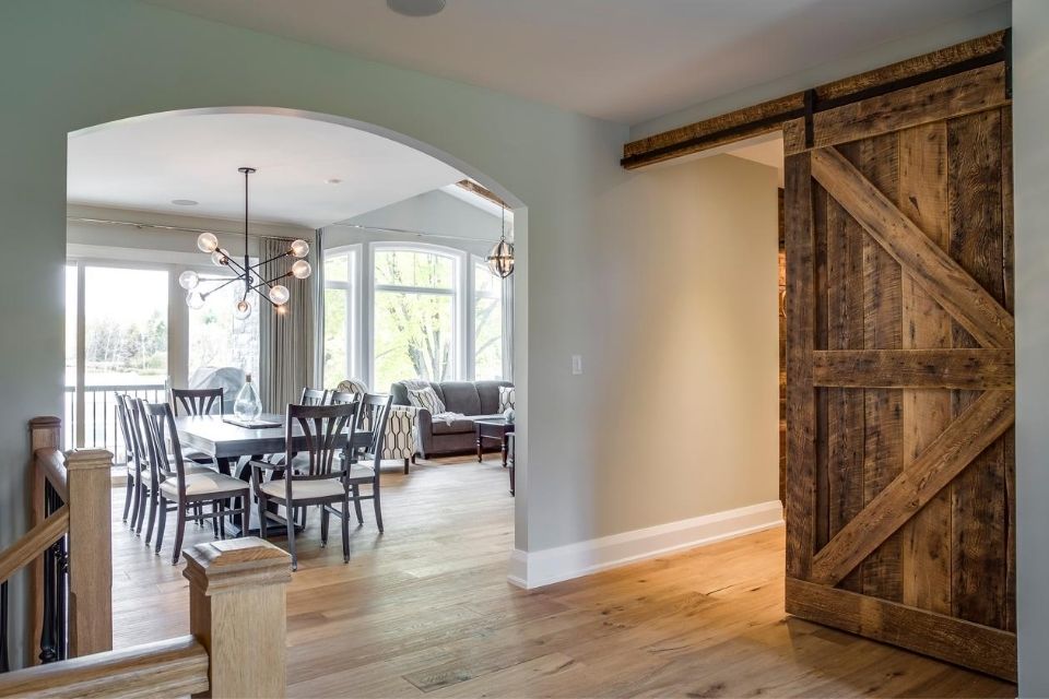 Entryway hardwood floors with barn door