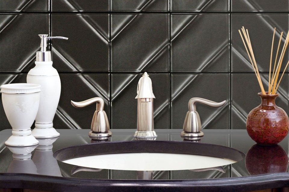 Kumito black backsplash tile behind bathroom sink